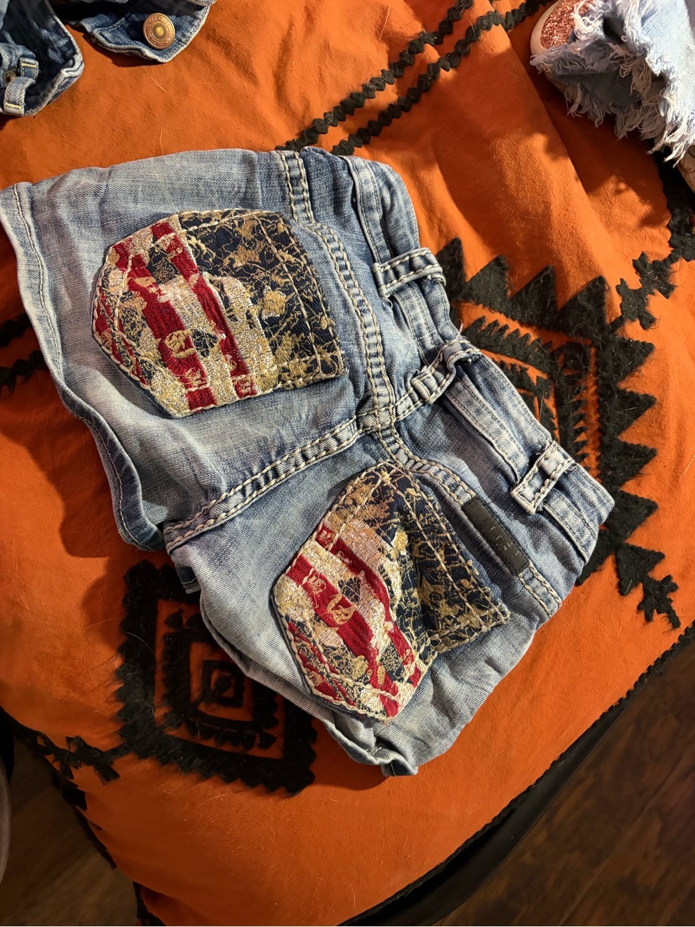Cowgirl Tuff Light Wash Denim Shorts with Red, Navy & Cream Patch Pockets